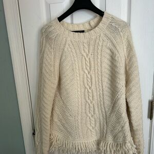 Banana Republic size Medium beige pullover sweater with fringe hem.